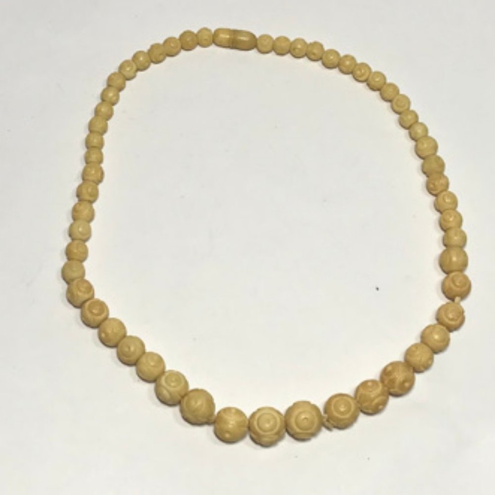 Carved bead necklace